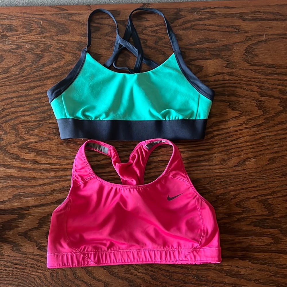 NorthFace blue/green crisscross sports bra (S). Nike pink sports bra (S).